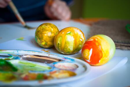 Children's creativity. The abstract colored painted eggs for Easter.の写真素材