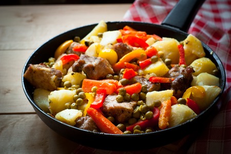 Meat with vegetables. Food in the frying pan. Main dish.の写真素材