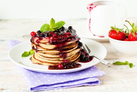 Pancakes. Stack of pancakes topped with berry jam. Breakfast.の写真素材