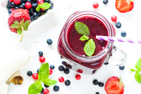 Smoothie. Berry mix smoothie in a mason jar on white background. Healthy drink.の写真素材