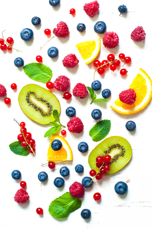 Fresh summer berries and fruits on white  background. Healthy food concept. Flat lay. Fruit background.の写真素材