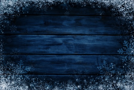 Wooden winter background. Blue horizontal boards with snow and snowflakes. Background for designの写真素材