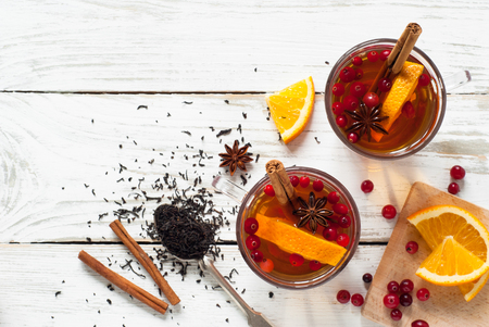Hot tea with fruit and spices in glass cup. Black fruit tea.の写真素材