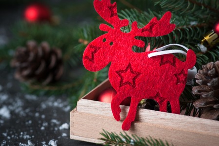 Traditional Sweden symbol Christmas Elk Moose. Christmas decorations in the box.の写真素材