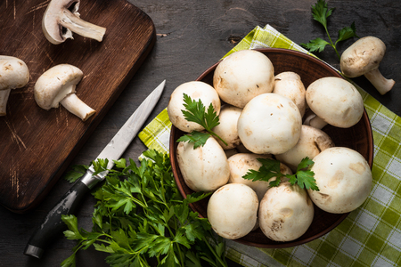 Mushrooms and ingredients for cooking. Top view, food background.の写真素材