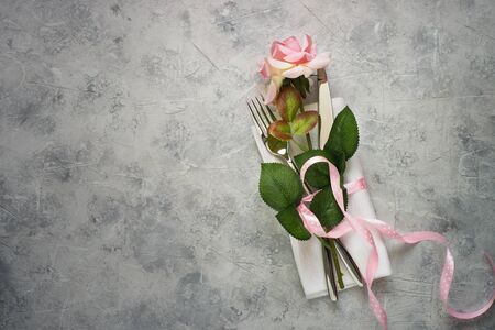 Valentines day table setting with rose flower. Top view copy space.の写真素材