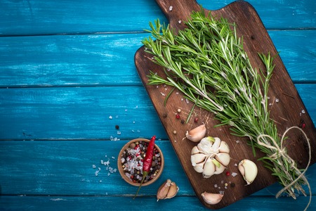 Herbs and spices at Blue wooden table. Cooking or food background. Food ingredients.の写真素材
