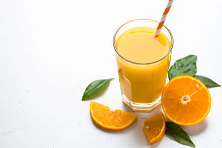 Orange juice in glass on white.の写真素材