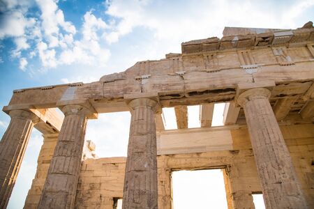 Propylaea of the Acropolis Athens, Greece. Ancient Architecture against blue sky and clouds.