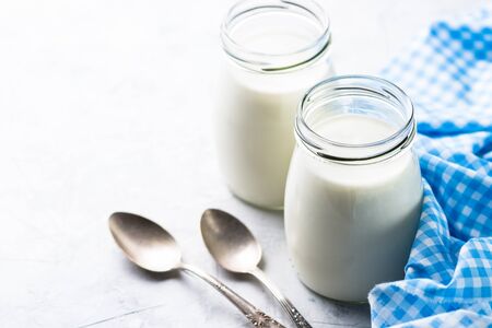 Fresh homemade greek yogurt in glass jars.の写真素材