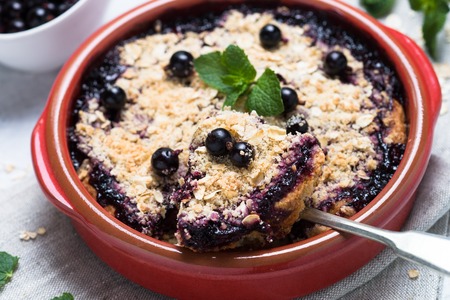 Homemade black currant crumble pie with oat. Sweet dessert. Summer beries pie.の写真素材