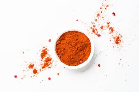 Ground chili pepper on white background. Top view with copy space.の写真素材