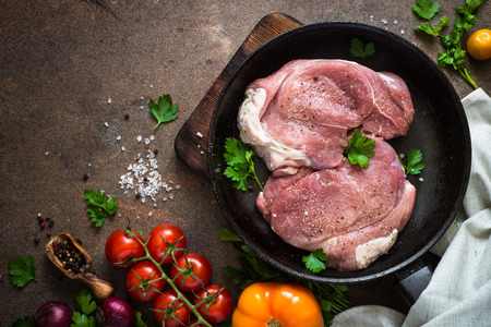 Raw pork meat in the pan.の写真素材