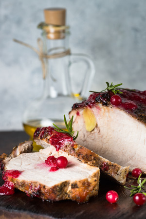 Pork ham baked with cranberry sauce. Close up.の写真素材