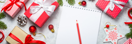 Christmas background. Christmas present and  wish list. Top view. Long banner format.の写真素材