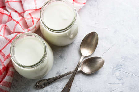 Greek yogurt in glass jars.