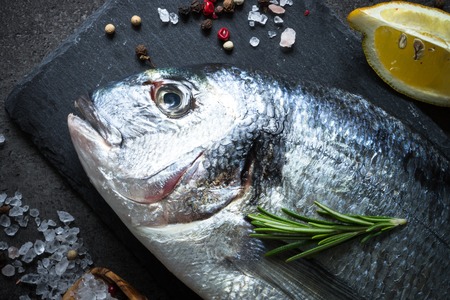 Dorado and ingredients for cooking