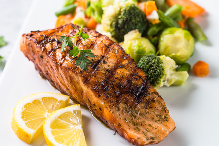 Grilled salmon fillet with vegetables mix.の写真素材