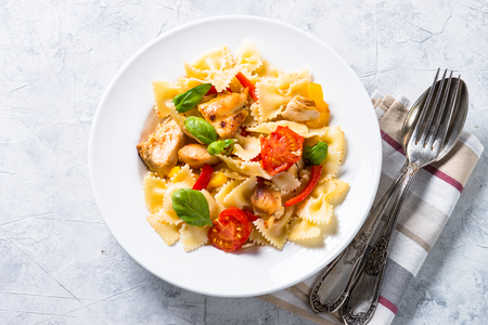 Pasta with chicken and vegetables top view.の写真素材