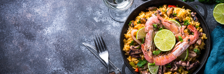 Seafood paella. Traditional spanish dish, european cuisine. Long banner formatの写真素材