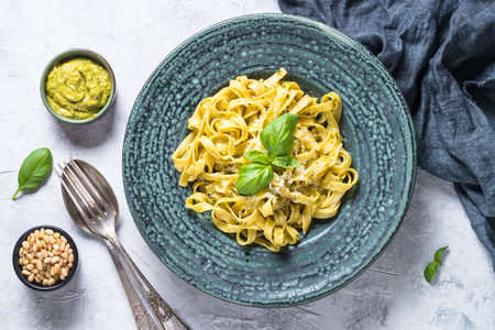 Tagliatelle pasta with pesto sauce and parmesan.の写真素材