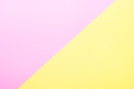 Yellow and pink paper background.の写真素材