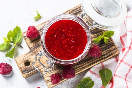 Strawberry jam in glass jar top view.の写真素材