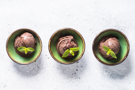 Chocolate ice cream top view on white.の写真素材