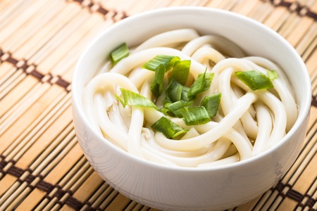 The udon noodles in a bowl close up. Traditional Japanese dish.の写真素材