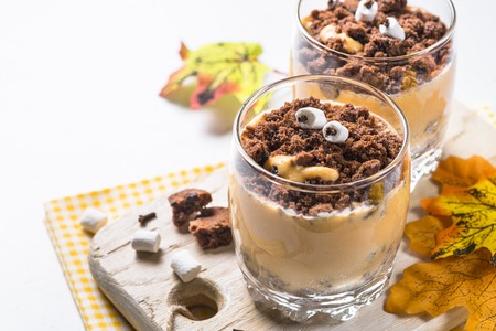 Halloween sweet dessert. Whipped cream with pumpkin and chocolate.の写真素材