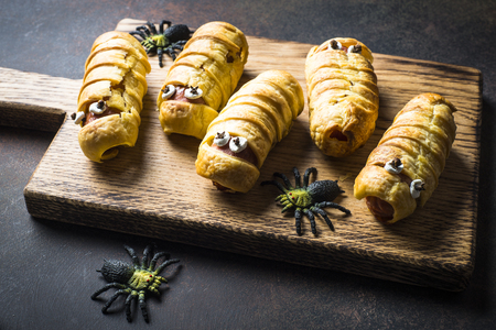 Halloween food. Scary sausage mummies in dough.の写真素材
