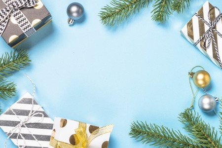 Christmas flatlay background - silver and gold decorations on bl