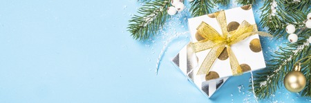 Christmas flatlay background - silver and gold decorations on bl