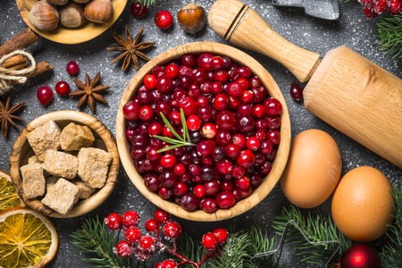 Christmas food baking background top view on black background.の写真素材