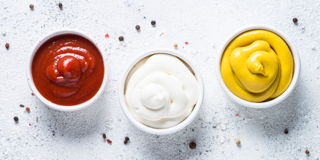 Sauce set  - mayonnaise, mustard, ketchup on white.の写真素材