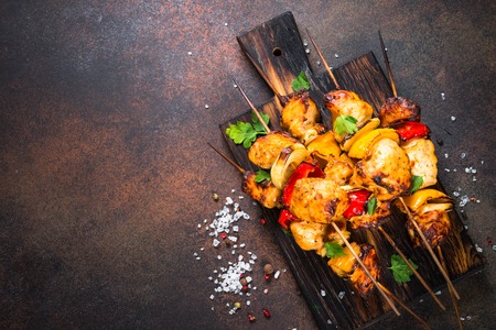 Chicken kebab  with vegetables on skewers top view.の写真素材
