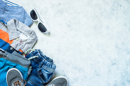 Child clothes - jeans, polo and sneakers top view.の写真素材