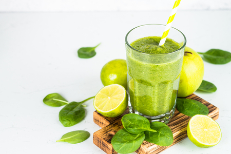 Green smoothie on white.の写真素材