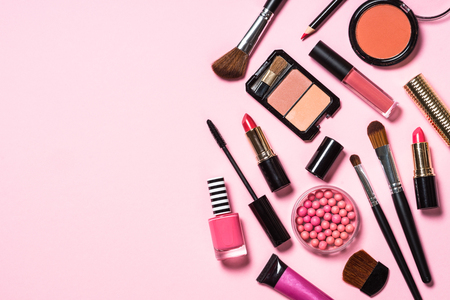Makeup professional cosmetics on pink background. Top view with copy space.の写真素材