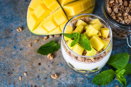 Parfait with yogurt, mango and granola top view.の写真素材