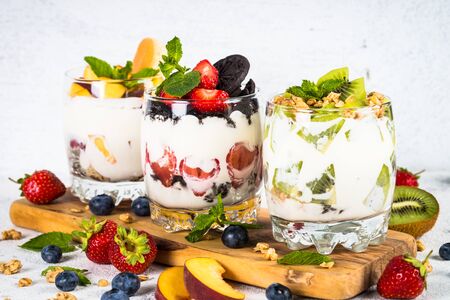 Fruit Dessert in glasses with yogurt and berries.の写真素材