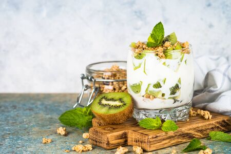 Kiwi parfait dessert in glass with ingredients.の写真素材