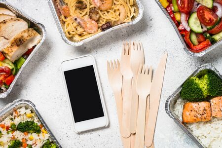 Food delivery concept - healthy lunch in boxes.