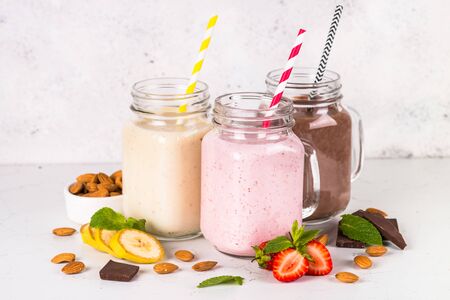 Banana, chocolate and strawberry milkshakes.の写真素材