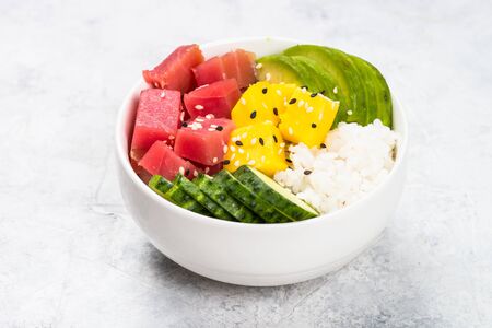 Tuna poke bowl with rice and vegetables.