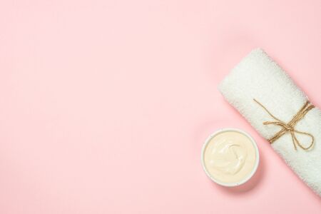 Clay mask on pink background, skincare product.の写真素材