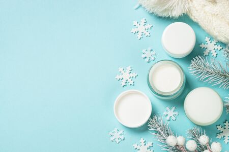 Winter cream for skin on blue top view.の写真素材