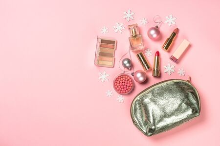 Makeup professional cosmetics with christmas decor on pink.の写真素材