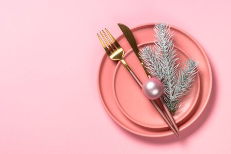Christmas table setting on pink top view.の写真素材