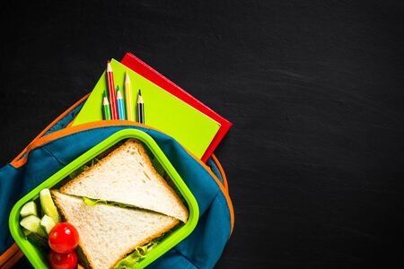 Back to school concept. Lunch box, stationery and backpack.の写真素材